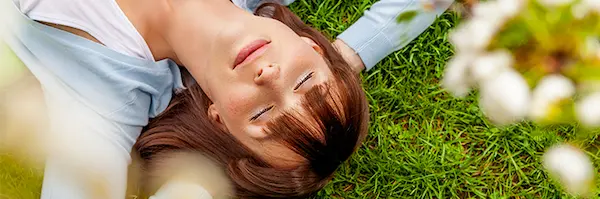 Woman resting on a lawn